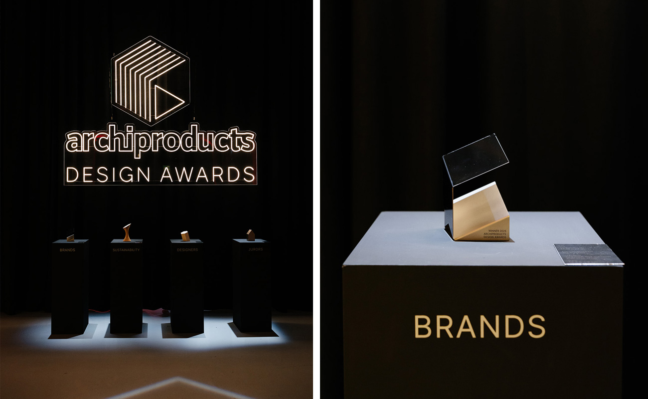 Illuminated Archiproducts Design Awards 2025 logo with trophies on display.