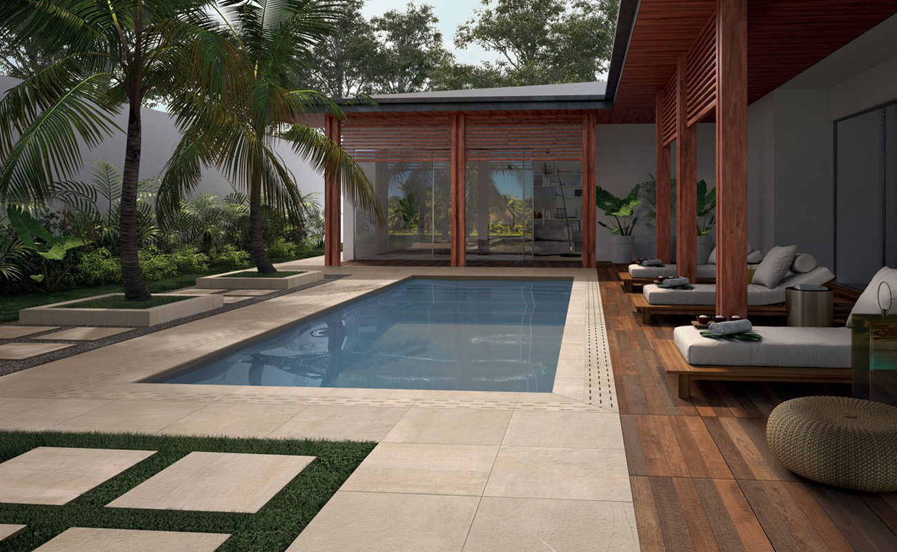 Outdoor and poolside setting with StoneOne concrete-effect tiles