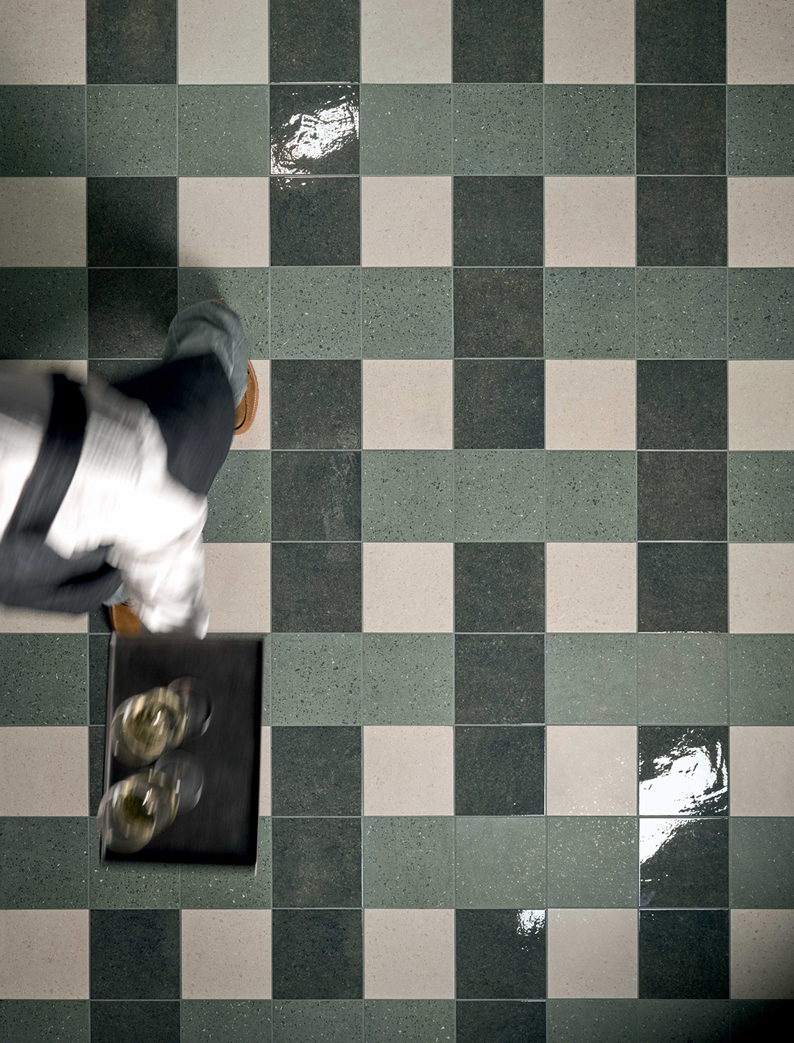 Terrazzo-style floor with green and beige tiles by Marca Corona Terrasale in a modern restaurant interior.