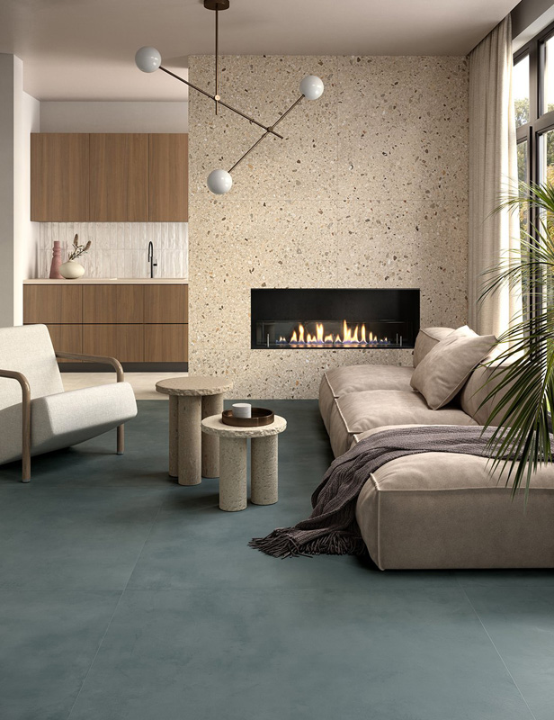 Living area with Arkistyle Shade Warm and Multiforme Talco (wall coverings), Multiforme Dune Tufo and Acquario (floor claddings).