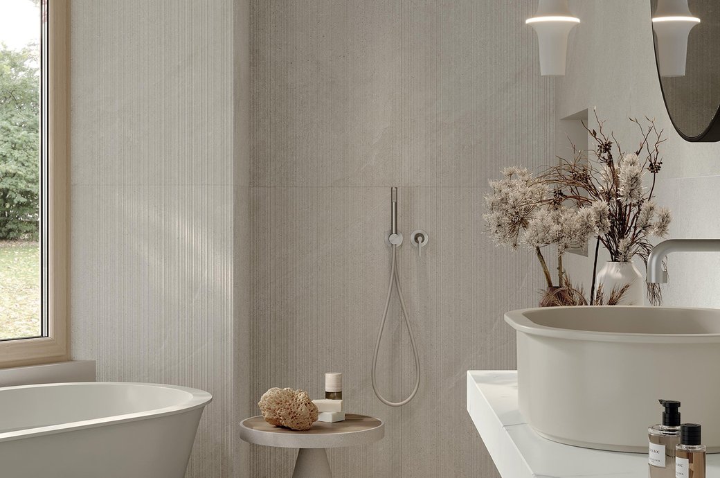 Outdoor terrace with stone‑effect porcelain flooring and dining table.