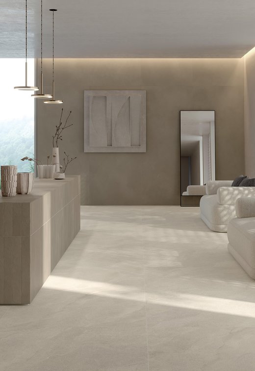 Reception moderna con pavimento e rivestimento in gres effetto pietra chiara.