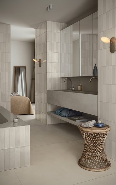 Modern kitchen with walls covered in glossy beige tiles.