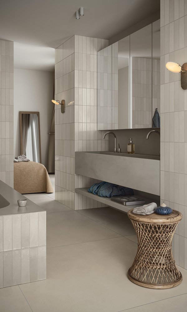 Modern kitchen with walls covered in glossy beige tiles.
