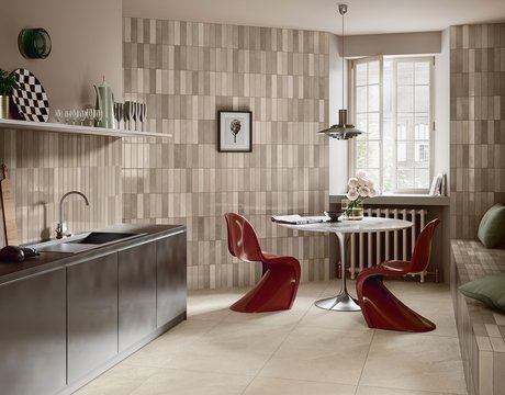Modern kitchen with walls covered in glossy beige tiles.