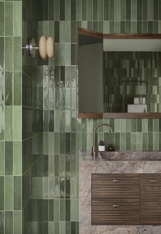 Green bathroom with stone sink