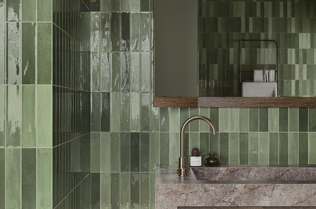 Green bathroom with stone sink