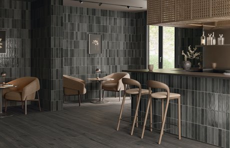 Restaurant with dark green tiles and bar